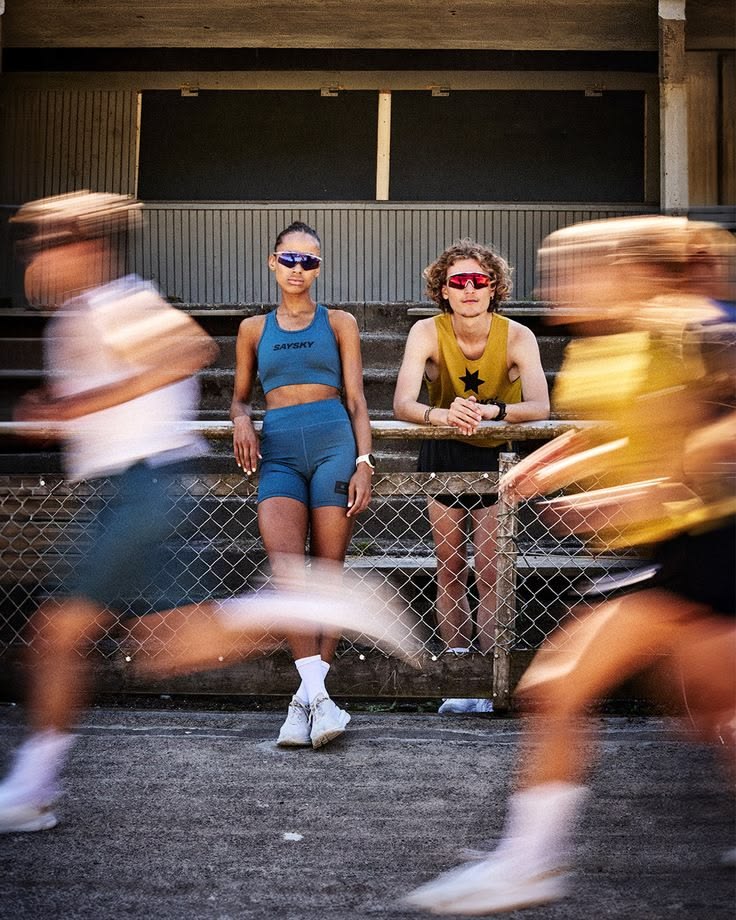 Runners pushing through a hard track session